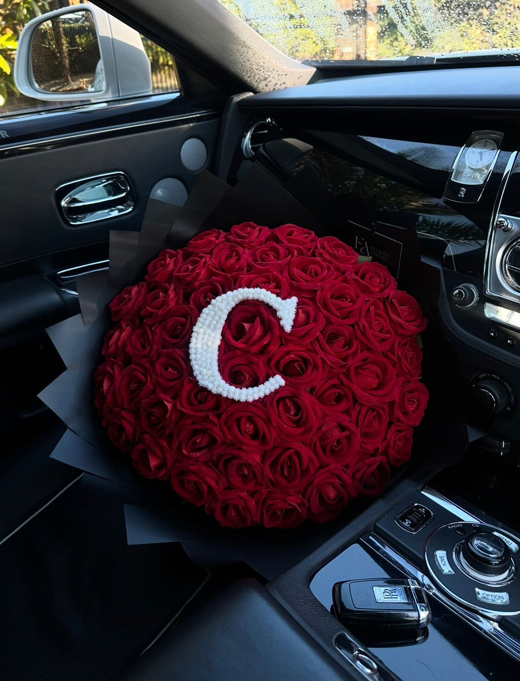 Forever artificial roses with her initial